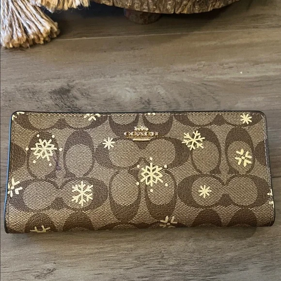 Coach Brown Signature Continental Wallet with Gold Snowflake Motif - Picture 1 of 6